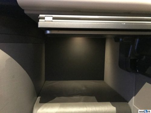 The MUCH larger window-side/middle foot well