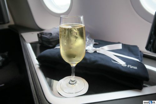 PDB champagne with the first class pajamas and amenity kit