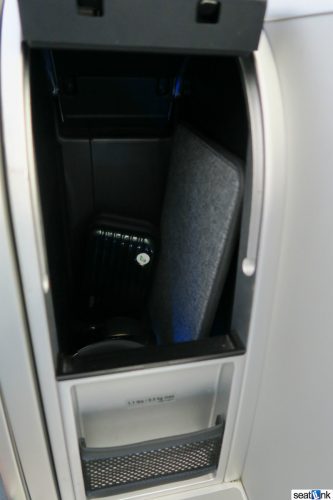 Mint class has excellent in-seat storage for computer etc.