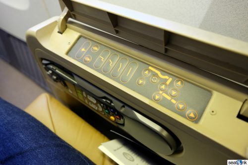 Seat controls tucked under the armrest