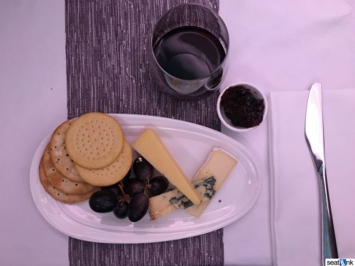 The Upper Class cheese plate with a glass of Port