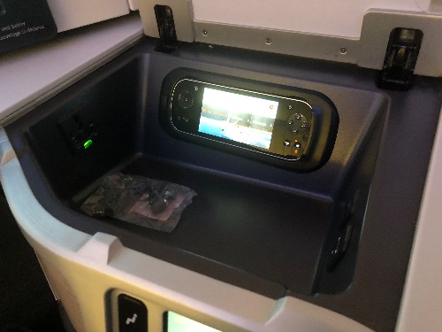 Side bin with handset, power outlet and headphones