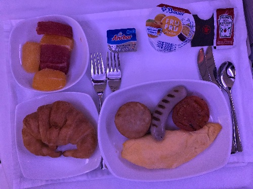 Omelette, sausage and croissant